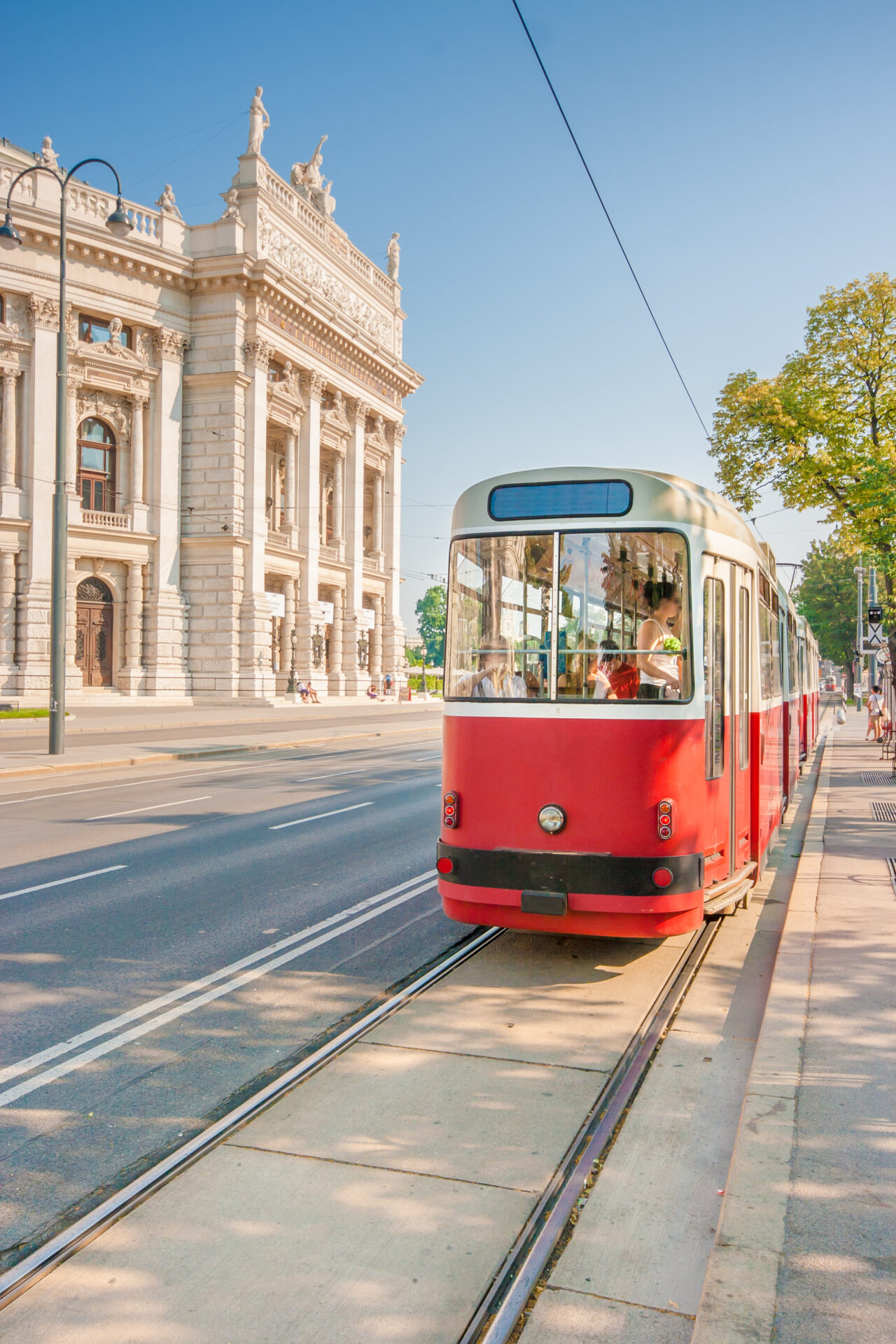 wiener burgtheater with traditional tram, vienna, austria